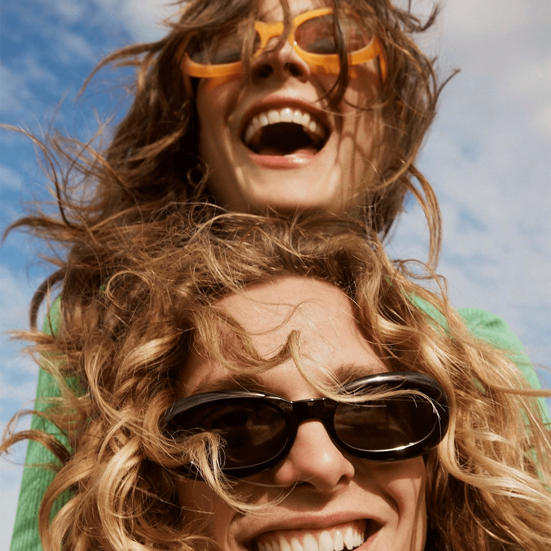 Two people laughing together